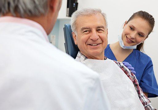 Smiling older man in dental chair