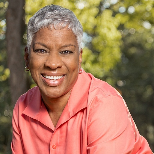 Older woman smiling outdoors