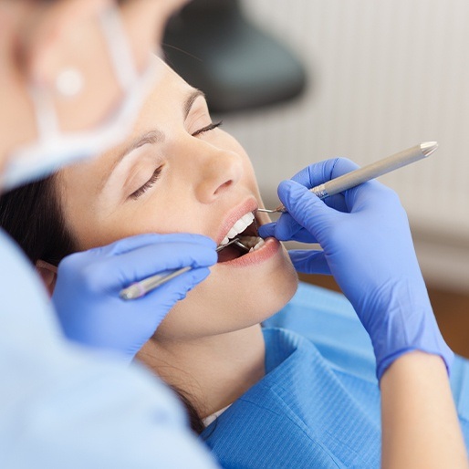 Relaxed woman receiving dental exam