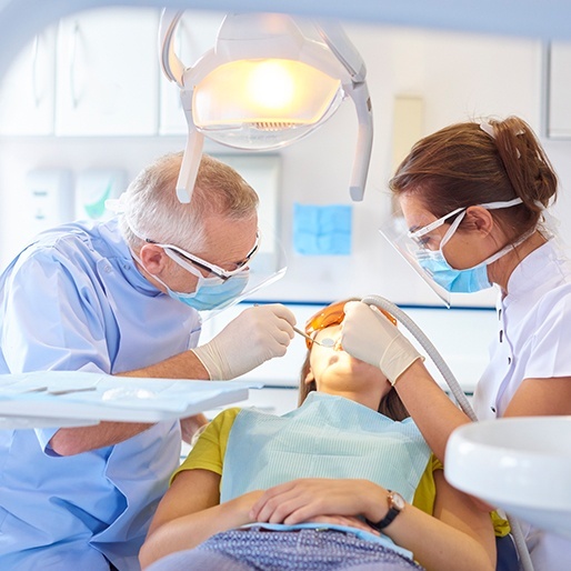 Woman receiving dental treatment